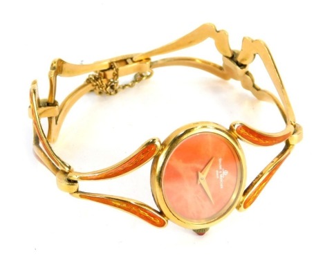 A Baume and Mercier fashion watch, with oval watch dial with an orange marbled backing, with three strap orange enamel V splayed chain link, yellow metal stamped 750, numbered 299 to clasp, numbered 402548 38244T2 to reverse, with ruby winder, 39g all in.