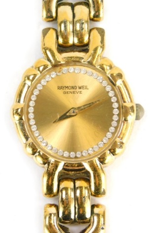 A Raymond Weil lady's wristwatch, with a gold coloured dial and paste stone set outer border, in a gold plated casing, heavily pitted and worn.