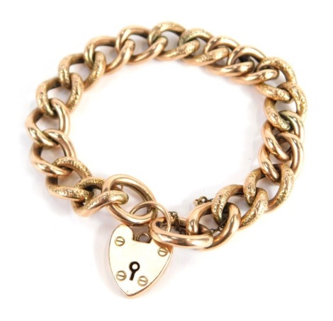 A rose gold charm bracelet, links of hammered design, with safety chain and heart shaped padlock, maker B&S, yellow metal stamped 9ct, 20cm long, 19.8g all in.