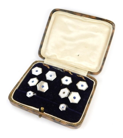 A gentleman's collar stud set, comprising pair of cufflinks, two collar studs, and four pins, each with mother of pearl front and central blue paste stone, white metal stamped silver, in fitted case.