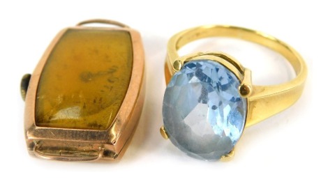 Two items of jewellery, comprising an 18ct gold aquamarine dress ring, the oval aquamarine in four claw raised and basket setting, ring size U½, 7.7g all in, and a 9ct gold cased wristwatch head, 9.9g all in. (2)