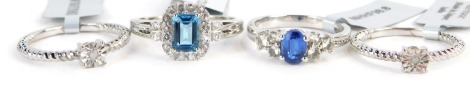 Four Gems TV dress rings, each stone set, two with light blue stones, the other with CZ and imitation diamonds, white metal stamped 925, with tags and pouches.