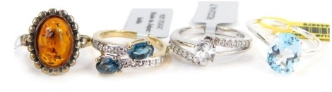 Four Gemporia dress rings, each stone set to include two silver gilt examples, white metal stamped 925, with tags and pouches.