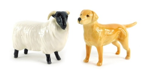 Two Beswick pottery figures, comprising a sheep, 8cm high, and a Labrador, 8cm high.