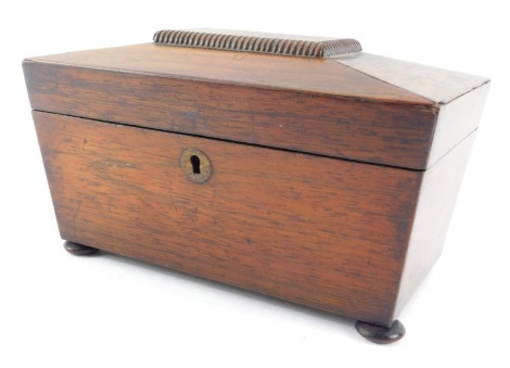 A 19thC rosewood sarcophagus shaped tea caddy, the hinged lid enclosing two lidded compartments on compressed bun feet, 14cm high, 23cm wide, 13cm deep.