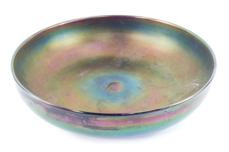 A 20thC lustre glass fruit bowl, purple ground with iridescent blue and green, unsigned, 34cm diameter.