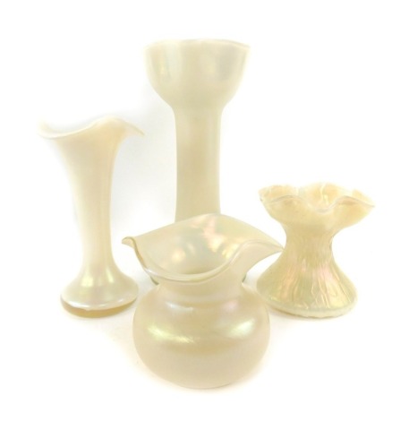 A group of milk glass lustre vases, each of differing form with flared neck, the largest 23cm high.