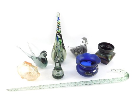 A group of glass ware, to include a twist glass cane, 49cm long, (AF), a novelty moulded glass piggy bank, 8.5cm high, an FM Konstglas Swedish paperweight modelled as a duck, 12cm high, further paperweights, etc. (a quantity)