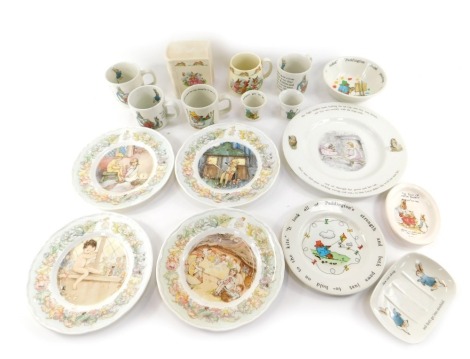 A group of children's ceramics, to include a Royal Doulton Bunnykins money box, modelled as a book, 10.5cm high, Bunnykins mug, various Wedgwood Peter Rabbit mugs, egg cups, and four Royal Worcester Peter Pan collectors plates, etc. (1 tray)