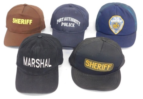 A group of American Police related baseball caps, comprising Nevada, United States Marshall, Sheriff cap, New York Port Authority, New York Police Department, City Housing, and Maine Waldo County Sheriff.