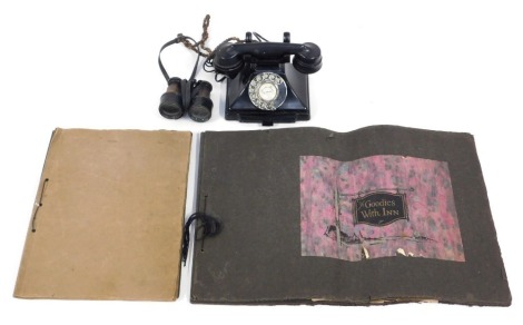 Two early 20thC and later scrap albums, containing House for Sale posters, cuttings depicting children, etc, together with a pair of binoculars, and a black plastic cased telephone.