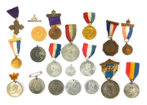 A group of Coronation and other medals, to include a George V and Queen Mary Jubilee medal, Edward VII coronation medal, Kings medal awarded to M Goldstein for punctual attendance, George VI coronation medal, etc. We have specific vendor instructions to s