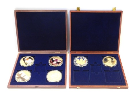 A group of commemorative gold plated coins, to include three Diamond Jubilee coins, Coin for the Year of The Three Kings 1936, etc, in two cases.