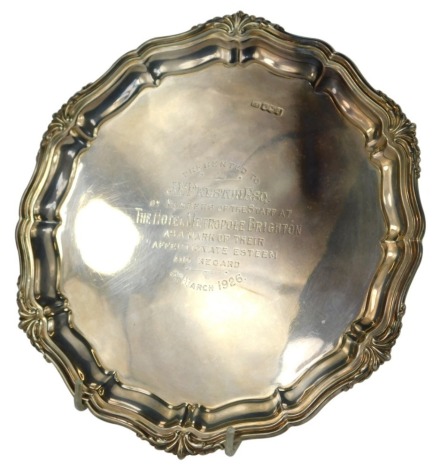 A George V silver card tray, with piecrust border, presentation engraved 'To J F Preston Esq., by Members of the Staff at The Hotel Metropole Brighton as a mark of their Affection Esteem and Regard, 8th March 1926', Sheffield 1921, 8.73oz, 20.5cm diameter