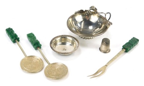 A group of white metal, to include a wine tasting cup, of circular tapering form, decorated with a vine leaf and grape handle, and a rope twist circular base, marked 925, with a bowl 6.5cm diameter, together with a pair of Mexican white metal spoons, and 