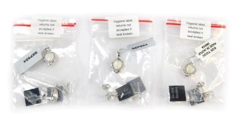 Three pendant and earring set, each set with imitation opal and white stones, comprising pendant and earrings, with labels and Gemtopia pouches.