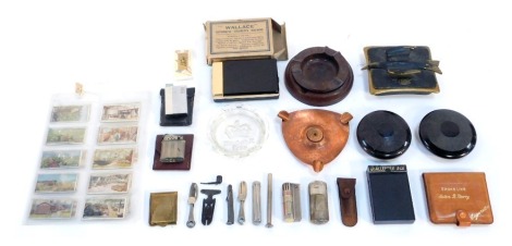 A group of smoking related items, to include cigar cutters, ashtrays, a Wallace Automatic cigarette machine, boxed, cigarette cards. (a quantity)