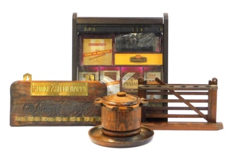 A group of smoking related items, to include oak pipe rack, an oak cigarette display case, 35cm x 29cm, etc. (a quantity)