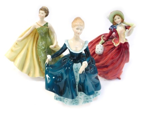 Three Royal Doulton porcelain figures, comprising Autumn Breezes HN1934, Janine HN2461, and Alexandra HN2398.