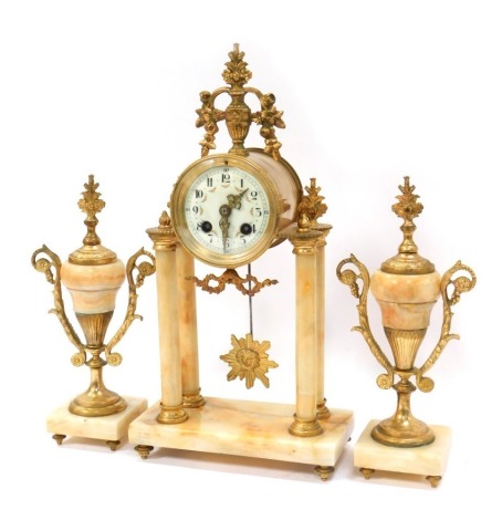 A 19thC French marble clock garniture set, the timepiece with cream floral decorated numeric face, in gilt casing with urn swags, on four columns, and matched urns, 43cm high, garnitures 28cm high.