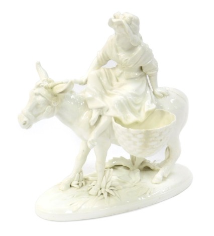 A 19thC Moore pottery blanc-de-chine glazed figure, of maiden riding donkey with water carriers, impressed to underside Moore England, 30cm high.