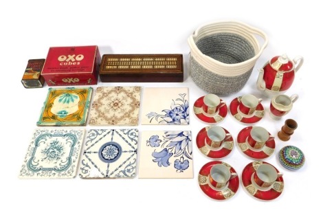 A group of ceramics, comprising a Czechoslovakian part coffee service in red, cream and gilt, comprising coffee pot, milk jug and six coffee cans and saucers, glass paperweight, treen dice cup, cased domino gaming board, OXO and Burdall's tins, and six ce