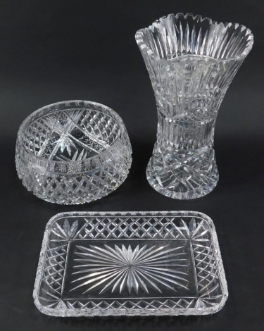 Three items of cut glassware, comprising bowl, 23cm diameter, rectangular tray, 29cm wide, and vase of waisted form, 30cm high.