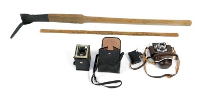 A Zeiss Ikon Colora F camera, in leather case, together with a Brownie camera, a Marshall Barty Drapers wooden metre rule, and a pick cutter.