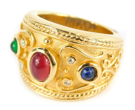 An eastern inspired semi-precious stone set dress ring, set with imitation semi-precious stones, on a gold plated band, ring size N½.