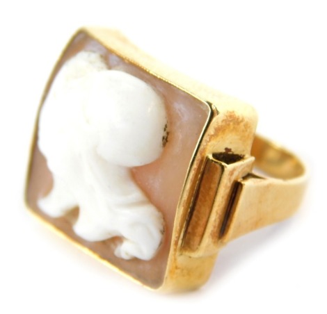 A cameo dress ring, the rectangular cameo head set with two female heads, on stepped design shoulders, yellow metal stamped 585, ring size H½, 5.7g all in.