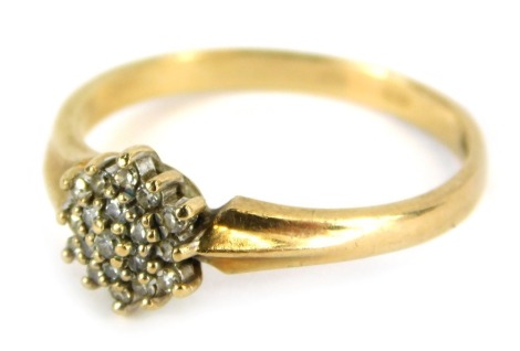 A 9ct gold diamond cluster ring, the floral cluster set with tiny diamonds on plain band, size P, 2.4g all in.