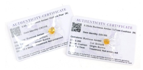 Two Gem Collector loose gemstones, each with certificate of authentic, comprising a 0.65 Burmese amber, pear cut, and a 0.35ct Burmese amber 7mm x 7mm cushion cut stone, each with certificate. (2)