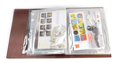 Four Royal Mail albums, comprising two The Classic Numismatic Covers coin albums, another album containing coin covers, and a Royal Mail presentation pack first day covers album. (4)