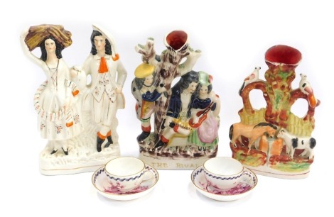 A group of Staffordshire style figure groups, comprising The Rival, 30cm high, spill vase decorated with horse and cow drinking at trough, 27cm high, flat back group depicting male and female, and two 19thC bat printed cups and saucers. (5)