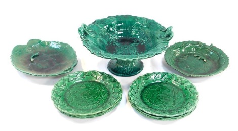 A group of 19thC and later majolica green leaf pottery, to include two handled pedestal dish, cake stand, 12cm high, various plates, etc. (a quantity)