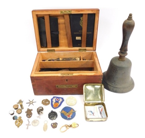 A group of 20thC naval related items, to include HMS Victory ribbons, a Continuous Certificate of Discharge book, ships bell, contained in an oak box, together with RAC badges, brass buttons, further bygones and ephemera, etc. (a quantity)