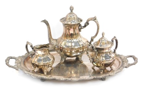 A 20thC electroplated Lancaster Rose by Rose three piece tea service, comprising teapot, milk jug and two handled sugar bowl, together with two handled tray, the tray 59cm wide.