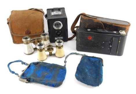 A Kodak No 1120 camera, in leather case, together with an Ensign FUL-VUE box camera and case, together with two pairs of opera glasses. (4)