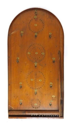 An early 20thC oak bagatelle board, 77cm high.