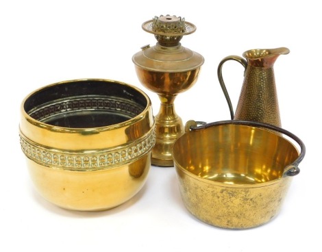 A group of brass ware, to include oil lamp base, 33cm high, circular planter, 25cm diameter, brass jam pan, etc. (a quantity)