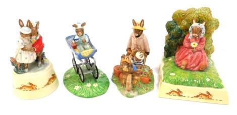 A group of Royal Doulton Bunnykins, to include a Summer Dreams bookend, Christening Day Boy figure group DB328, Home Ground figure group DB429, and a Bunnykins Winter Waltz musical figure group, 14cm high.