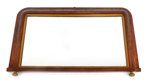 A late 19th/early 20thC oak boxwood inlaid overmantel mirror, of rectangular form with rounded corners, raised on two turned brass feet, 50cm x 84cm.