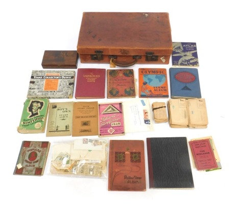 A 20thC leather case, containing a quantity of GB and World stamps, loose and in albums, to include New Zealand, Canada, Australia, India, Spain, Holland, Russia, Greece, France, etc.