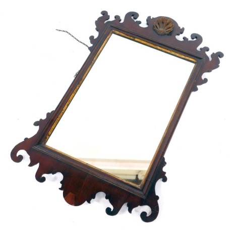 An 18thC style mahogany and parcel gilt fret work wall mirror, with a rectangular glass plate, 95cm x 59cm.