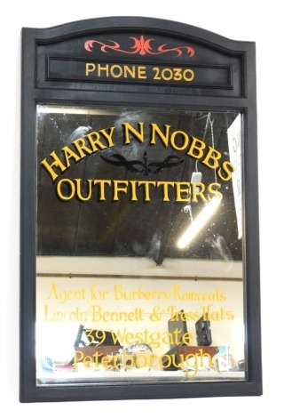 A 20thC painted hardwood mirror, with later advertising print for Harry N Nobbs Outfitters, Agent for Burberry Raincoats, Lincoln, Bennett and Tress, 39 Westgate, Peterborough. 116cm x 71cm.