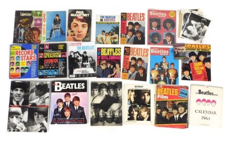 A group of The Beatles related printed material, to include Meet The Beatles 1963, Beatles book calendar 1964, The Beatles in America 1964, The Beatles Around the World 1964, The Beatles Book Special Christmas Extra 1965, etc, together with further contem