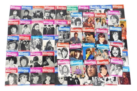 A group of The Beatles Monthly Book, Issues 10 to 77, together with a special repeat issue of the first six issues, contained in a single Beatles book.