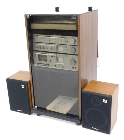 An Akai music system, comprising stereo cassette deck, CS-M3, stereo integrated amplifier AM-U11, FMAM stereo tuner AT-K11L, together with a Rotel turntable, and a pair of Wharfdale speakers contained in a cabinet. WARNING! This lot contains untested or 