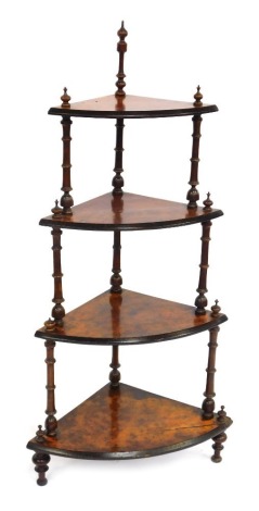 A Victorian figured walnut corner whatnot, of three tiers, with bobbin turned supports, 115cm high, 64cm wide, 40cm deep.