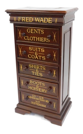 A mahogany chest of five drawers, converted to an advertising cabinet for Fred Wade Gent's Clothers, with bun handles on bracket feet, 126cm high, 66cm wide, 47cm deep.